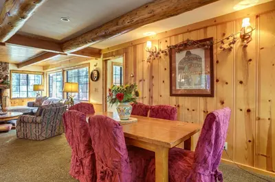 a dining room with a wooden table and chairs at Less Than 1 Mi to Lake Tahoe Beaches Home with Fire Pit! in Tahoe City