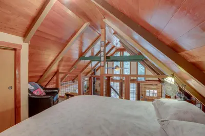 a bedroom with a bed and a large window at Less Than 1 Mi to Beach Peaceful Studio with Deck in Tahoma in Tahoma