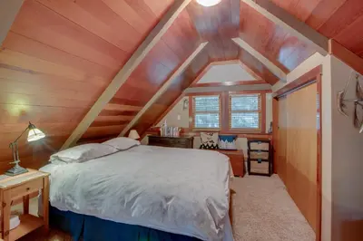 a bedroom with a bed and a wooden ceiling at Less Than 1 Mi to Beach Peaceful Studio with Deck in Tahoma in Tahoma