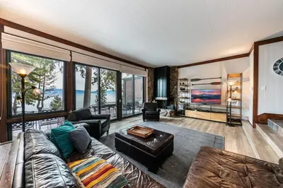 a living room with a couch and a table at 4BD Lakeside Retreat with Views in Tahoe City