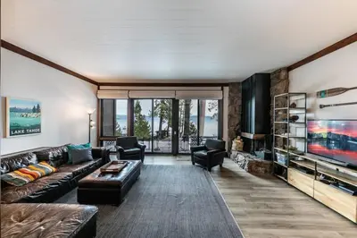 a living room with a couch and a tv at 4BD Lakeside Retreat with Views in Tahoe City