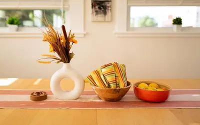 a vase and bowls of food on a table at Reno's Biggest Little House - Cozy Home Theatre in Reno