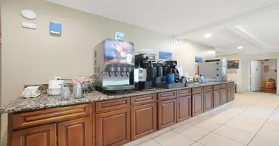 a kitchen with a counter with a coffee maker on it at Best Western Amador Inn in Jackson