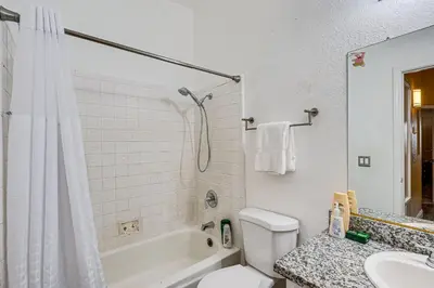 a bathroom with a shower and a toilet and a sink at Cozy Antelope Home about 14 Mi to Sacramento! in Antelope