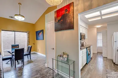a kitchen and dining room with a table and a dining room at Cozy Antelope Home about 14 Mi to Sacramento! in Antelope