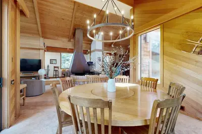 a dining room with a wooden table and chairs at Timberline Daydream in Truckee