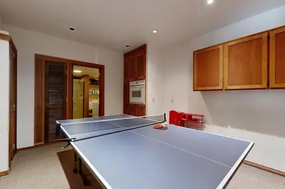 a ping pong table in the middle of a kitchen at Timberline Daydream in Truckee