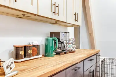 a kitchen counter with a coffee maker on it at 3 Mi to Calaveras Big Trees Cabin with Fire Pit! in Arnold