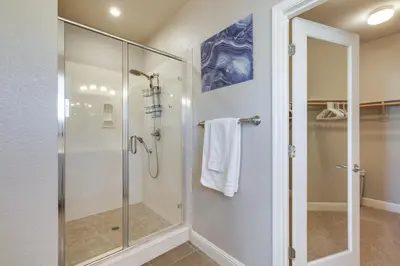 a shower with a glass door in a bathroom at Stylish Lodi Wine Country Retreat with Private Patio in Lodi