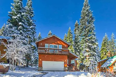 a house in the snow with a garage at A Taste of Tahoe in Tahoe Vista