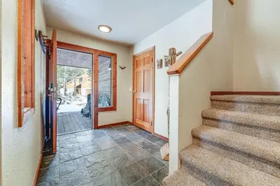 aoyer with a staircase and a door with a door at Family Cabin with Community Perks in Truckee! in Truckee