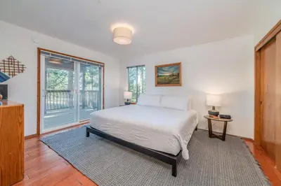 a bedroom with a bed and a large window at Ravenhill in Arnold