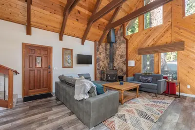 a living room with a couch and a table at Moonlit Pines in Camp Connell