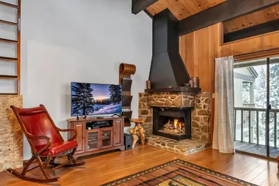a living room with a fireplace and a television at 3BD Three Minutes from King Beach in Kings Beach
