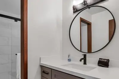 a bathroom with a sink and a mirror at 3BD Three Minutes from King Beach in Kings Beach