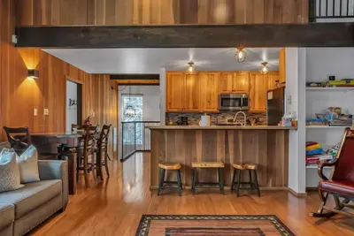 a kitchen and living room with a couch and a table at 3BD Three Minutes from King Beach in Kings Beach