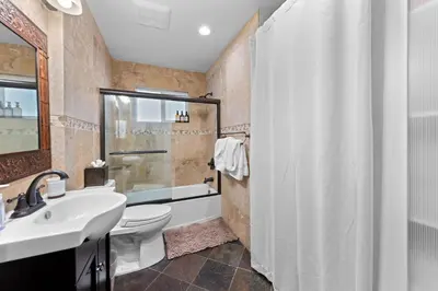 a bathroom with a sink and a toilet and a shower at Hideaway in the Highlands - 4BR, Pet Friendly w Hot Tub - Minutes from the Lake & Tahoe City in Tahoe City