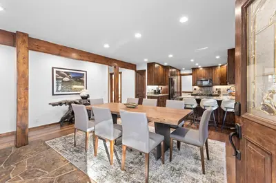 a dining room with a wooden table and chairs at Hideaway in the Highlands - 4BR, Pet Friendly w Hot Tub - Minutes from the Lake & Tahoe City in Tahoe City