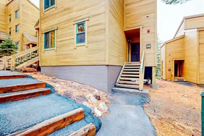 a house with stairs leading up to a building at Northstar Nirvana in Truckee
