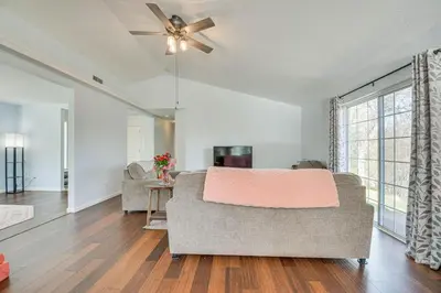 a living room with a couch and a ceiling fan at Bright and Cozy Mariposa Getaway 46 Mi to Yosemite! in Mariposa