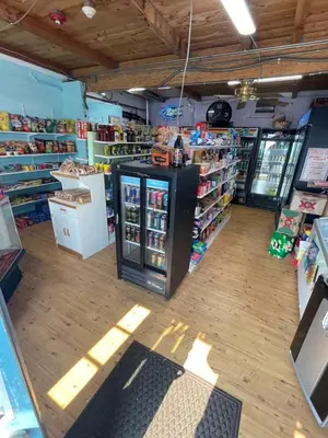 a store aisle with a counter in the middle at Sugarloaf Mountain Motel in Virginia City
