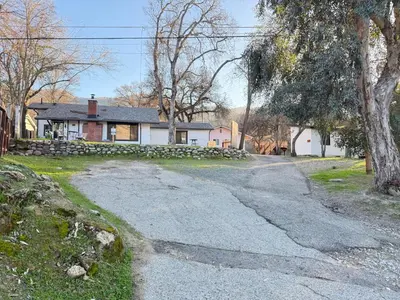 an empty road in front of a house at Modern Cabin, Near Snow Park, 3.5 Miles to SNP! in Three Rivers