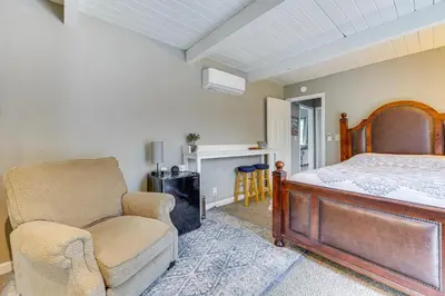 a bedroom with a bed and a chair at Bay Area Escape on 5 Acres Pet Friendly, Views in Pilot Hill