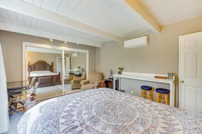 a bedroom with a large bed and a room with a bed sqor at Bay Area Escape on 5 Acres Pet Friendly, Views in Pilot Hill