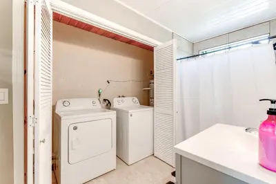 a bathroom with a washing machine and a washer and dryer at Bay Area Escape on 5 Acres Pet Friendly, Views in Pilot Hill