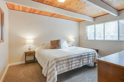 a bedroom with a bed and a window at Serene Cabin Retreat Between Murphys and Arnold in Murphys