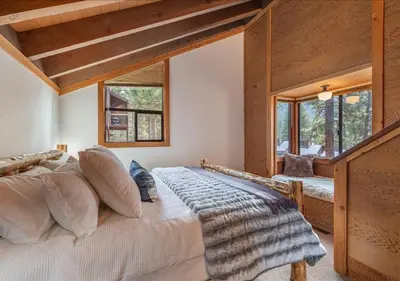 a bedroom with a large bed and windows at Northstar Resort Condo for 8 Free Shuttle in Truckee