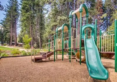 a playground with a slide in a park at Northstar Resort Condo for 8 Free Shuttle in Truckee