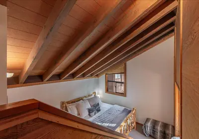 a room with a bed in a room with wooden ceilings at Northstar Resort Condo for 8 Free Shuttle in Truckee
