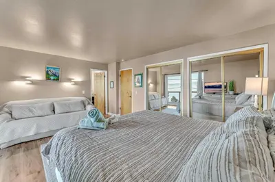 a large bedroom with a large bed and a couch at Big Blue Views Walk 2 Lake in Tahoe Vista