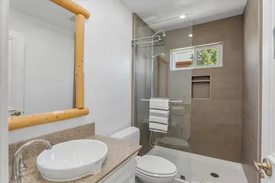 a bathroom with a sink and a toilet and a shower at Big Blue Views Walk 2 Lake in Tahoe Vista
