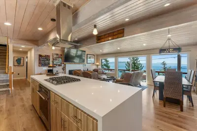 a kitchen and dining room with a view of the ocean at Big Blue Views Walk 2 Lake in Tahoe Vista