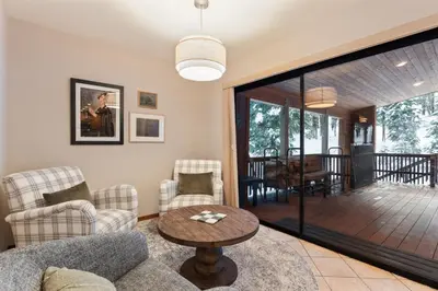 a living room with a couch and chairs and a table at The Pinecrest Retreat- 10 mins to NorthStar! Hot Tub, Large Deck, Views, and Games in Tahoe Vista