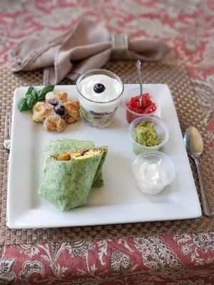 a white plate with some food on a table at Bella Vista Bed and Breakfast in Coloma