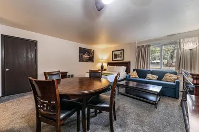 a living room with a table and a couch at Cozy Studio w/Kitchenette Easily Accessible #113 at Donner Lake Village in Truckee