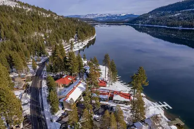 an aerial view of a resort on the shore of a lake at Charming Studio Deluxe w/Full Kitchen #115 at Donner Lake Village in Truckee