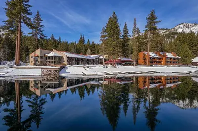 a resort with a reflection in the water at Charming Studio Deluxe w/Full Kitchen #115 at Donner Lake Village in Truckee