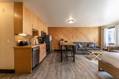 a room with a kitchen and a living room at Lovely Studio w/Kitchen and Partial Lake View #122 at Donner Lake Village in Truckee