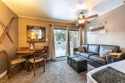 a living room with a couch and a table at Cozy Studio 1st Floor #132 at Donner Lake Village in Truckee