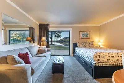a bedroom with a bed and a couch at Quaint Studio w/Lake View #146 at Donner Lake Village in Truckee