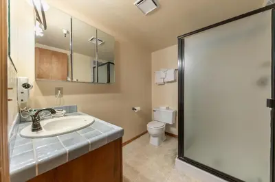a bathroom with a sink and a toilet at Comfortable Townhouse w/Lake View #154 at Donner Lake Village in Truckee