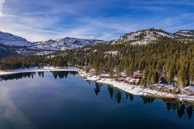 an aerial view of a lake with snow covered mountains at Cozy Studio w/Kitchenette and Balcony #212 at Donner Lake Village in Truckee