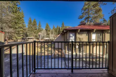 a black metal fence in front of a house at King Deluxe Studio 2nd Floor Unit 216 Bldg B in Truckee