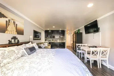 a bedroom with a large bed and a dining room at King Deluxe Studio 2nd Floor Unit 216 Bldg B in Truckee