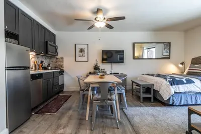 a kitchen and a bedroom with a bed and a table at Beautiful Deluxe Studio w/Lake View #245 at Donner Lake Village in Truckee