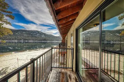 a balcony of a house with a view of a lake at Beautiful Studio w/ Lake View #243 at Donner Lake Village in Truckee